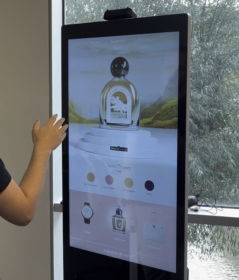 A kiosk with a retail application being used. Showing the inner mechanics of a watch being explored.
